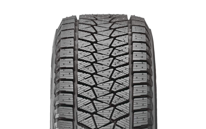 Technician performing a close-up tire inspection